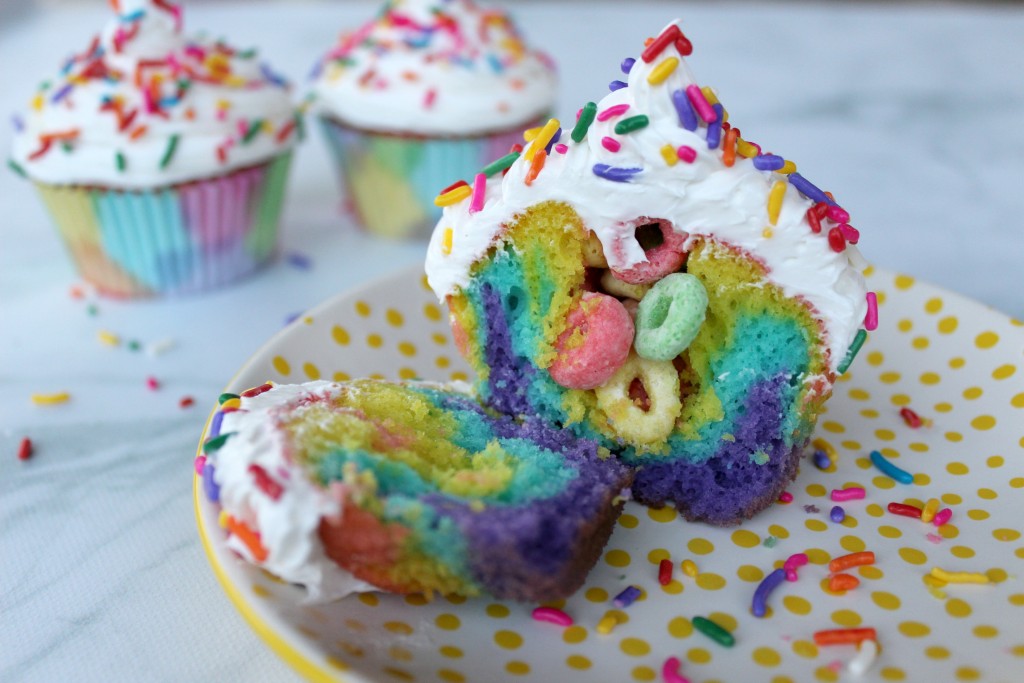 Rainbow surprise cupcakes. Find this and more great ideas for your summer potluck here.